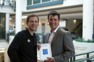 CognisantMD co-founders, Dr. Doug Kavanagh (left) and Jeff Kavanagh (shown in Toronto in this recent photo), display their OceanWave tablet, which allows patients to submit information to their electronic patient records - from contact information to a detailed patient history - using a simple touchscreen or online interface.